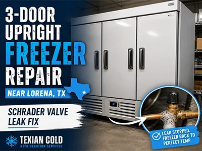 Technician servicing a leaking discharge valve on a 3-door upright commercial freezer near Lorena, TX