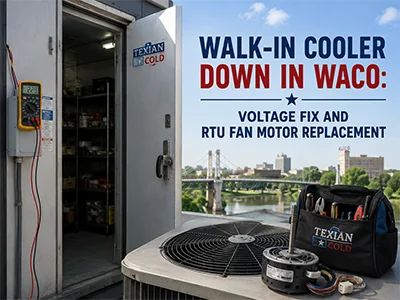 Technician inspecting a commercial walk-in cooler condenser at a Waco, TX facility