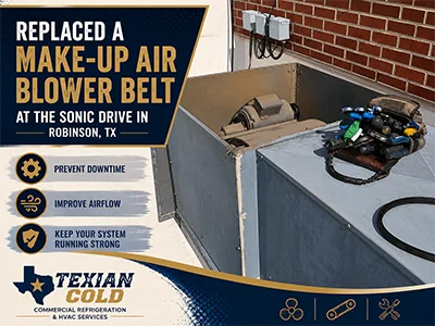 Technician servicing a commercial make-up air unit blower on a restaurant rooftop in Waco, TX