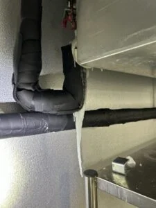 Ice Buildup Behind a Walk-In Evaporator at a Waco Restaurant
