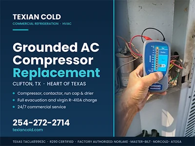 Technician using a megohmmeter to confirm a grounded compressor on a commercial AC unit in Clifton, TX