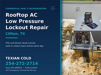 Commercial rooftop AC unit with its control panel open during a low pressure lockout repair in Clifton, TX